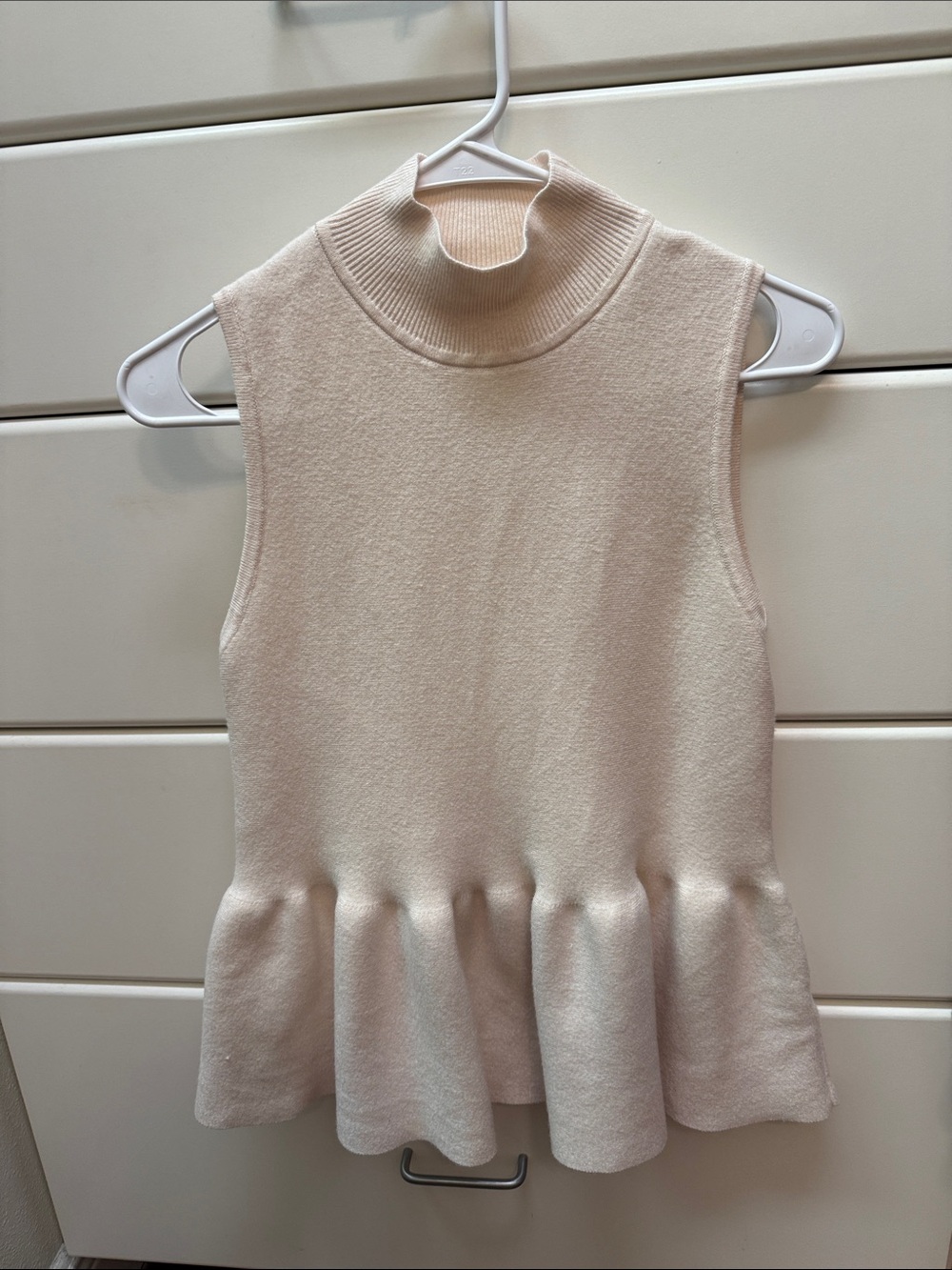 Fate Cream Sleeveless Peplum Mock Neck Top